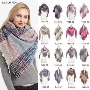 Close-up of plaid grid pattern scarf with fringe edges in various autumn color options