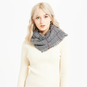 Classic houndstooth scarf with tassels in black white and red for winter warmth