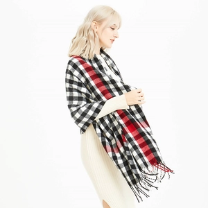 Classic plaid warm winter scarf with fringes in black, white, and red tartan pattern