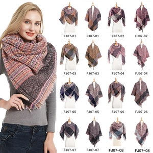 Thick checkered knit scarf and shawl collection featuring various patterns and fringe trim