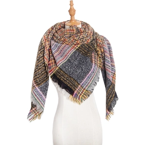 Close-up of multicolor plaid scarf with fine woven texture and short fringe edges
