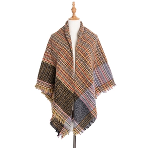 Detailed view of the multi-colored plaid scarf featuring vibrant fringes and retro pattern