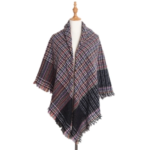Detail of multi-color plaid shawl with soft texture and short fringe edges
