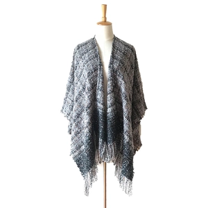Women's thick plaid poncho scarf with grey tweed pattern and long tassel hemline
