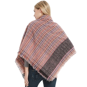 Thick colorful plaid poncho with fringe details and dark panel for women and men