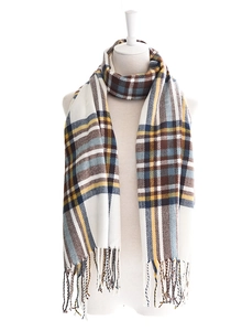 Macro shot of British plaid scarf with soft fringe and multicolor woven texture