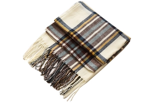 Close-up of thick beige plaid scarf with blue and yellow tassels and soft wool-like texture