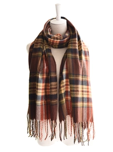 Close-up of British plaid tassel scarf with brown and orange checkered patterns