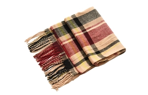 Detailed view of the soft plaid pattern fabric and fringe edges on the winter scarf