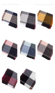 Close-up of assorted plaid scarves with herringbone weave and fringe detailing in various colors
