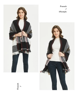 Close-up of classic red and black plaid scarf featuring soft fringe edge detail