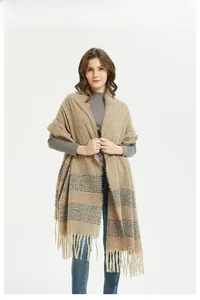 Detail of soft beige striped scarf with fringes, cashmere feel winter wrap for women