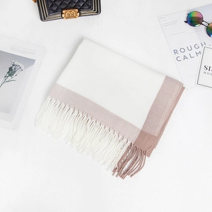 Detail of color-block scarf with ivory cashmere-like fabric and pink fringe edge