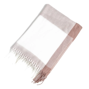 Close-up of pink and white checkered cashmere scarf featuring soft texture and fine tassels