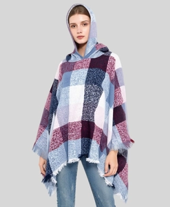 Detail of hooded plaid poncho with fringe tassels in purple and blue checkered knit