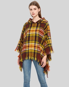 Detailed view of the vintage plaid hooded poncho featuring soft tassel fringes and warm knit