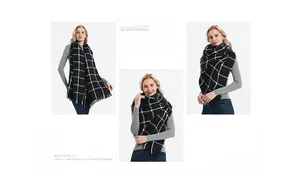 Detailed view of black and white plaid scarf featuring classic fringe and cashmere-like texture