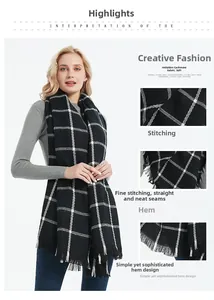 Detail view of black and white plaid cashmere scarf featuring soft fabric and fringe edges