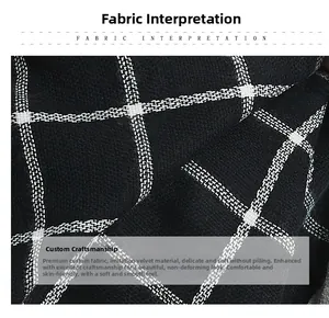Macro detail of soft black and white plaid cashmere-feel fabric with smooth texture