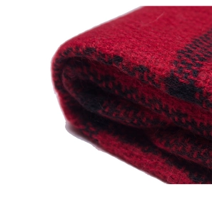 Detailed close-up of red and black plaid scarf texture with soft cashmere-like finish