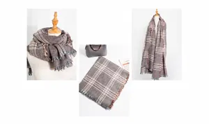 Detailed view of the soft plaid texture and tassel edges of the winter thick scarf
