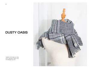 Detailed view of thick grey houndstooth scarf with elegant fringe trim texture