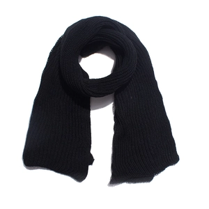 Detail of black knitted scarf with chunky vertical rib texture and thick acrylic yarn