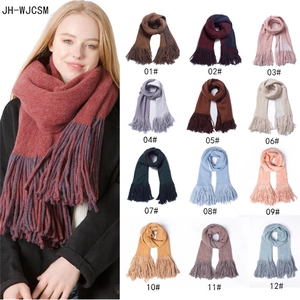 Thick solid color scarf with long tassels in 12 colors shown on model and grid