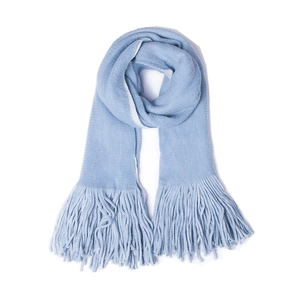 Close-up of the light blue long fringe detail on the soft thick knit winter scarf