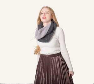 Close-up of two-tone gray knit snood scarf texture with a chunky rib-knit design