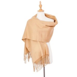 Close-up of camel cashmere-like scarf showing twill texture and fringe details