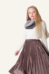 Close-up of dual-tone grey chunky knit scarf paired with a white ribbed sweater