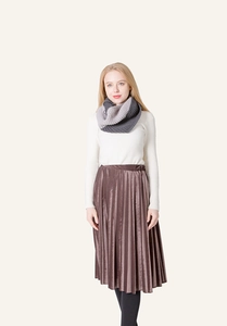 Detail of grey color-block knit snood paired with velvet skirt for a cozy winter look