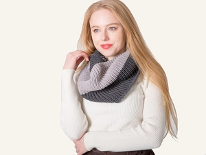 Detail showing two-tone grey ribbed knit infinity scarf with thick wool texture