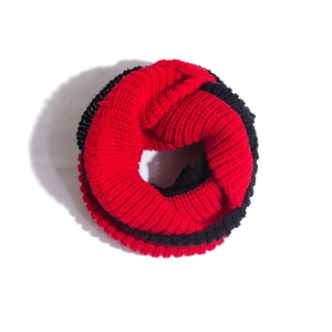 Close-up of winter knit neck warmer with red and black thick ribbed texture