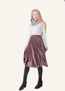 Detail of warm winter knit scarf with brown velvet pleated skirt and boots