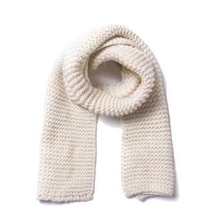 Detailed view of thick off-white knit texture on a cozy winter unisex scarf