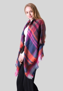 Detail of colorful plaid scarf with fringes in navy blue, magenta, and orange tones