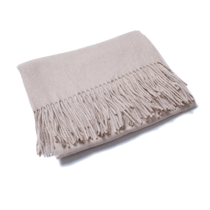 Detailed close-up of beige wool scarf with soft texture and long tassel edges