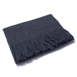 Detailed view of dark grey solid wool scarf showing fine texture and fringe edges