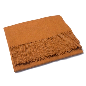Close-up of ginger yellow wool scarf featuring thick fringe and soft knit texture