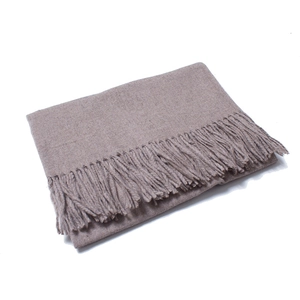 Detailed view of the soft brown wool scarf featuring elegant long tassel edges and texture