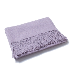 Detail shot of solid lilac purple wool scarf featuring long delicate fringe tassels