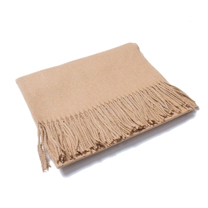 Detailed view of light beige wool scarf featuring soft tassels and premium woven texture