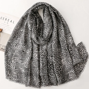 Leopard print cotton linen scarf with frayed edges in black and white tones