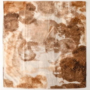 Detail of brown gradient cotton-linen scarf with ink wash art pattern and frayed edges