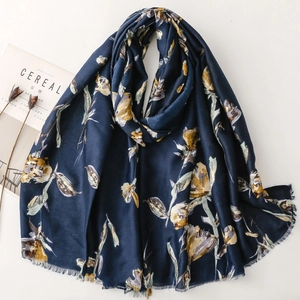 Floral print cotton linen scarf in navy blue with yellow flowers and fringe edges