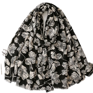 Elegant black and white ginkgo leaf print scarf with frayed edges for women