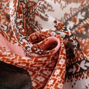 Detailed macro view of paisley pattern and soft weave on bohemian cotton linen scarf