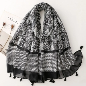 Bohemian paisley and geometric print scarf with black tassels for beach vacations